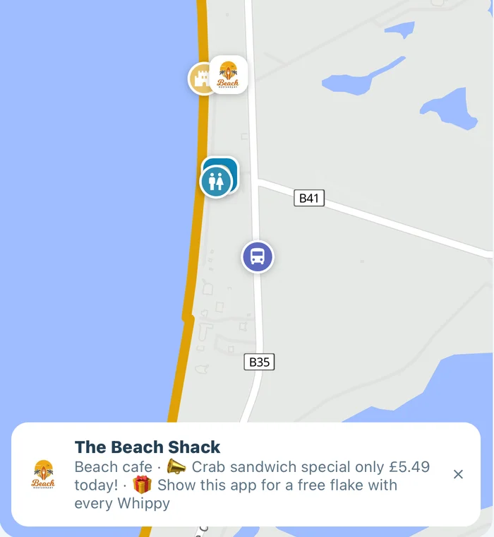 A trader's pin on the island map, tapped to show their card
